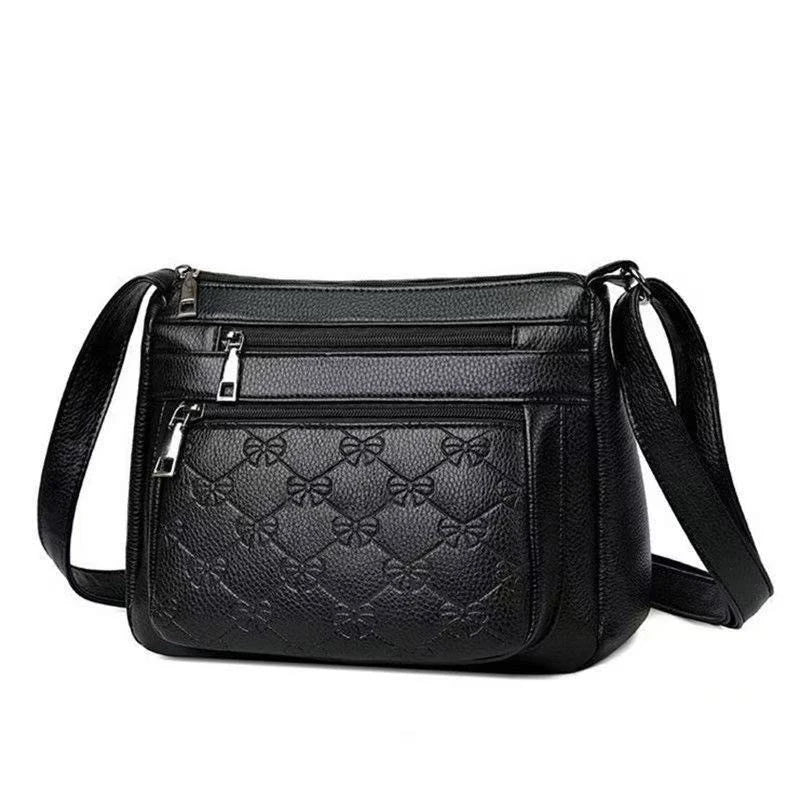 Bolsa transversal matelassê preta com vários compartimentos