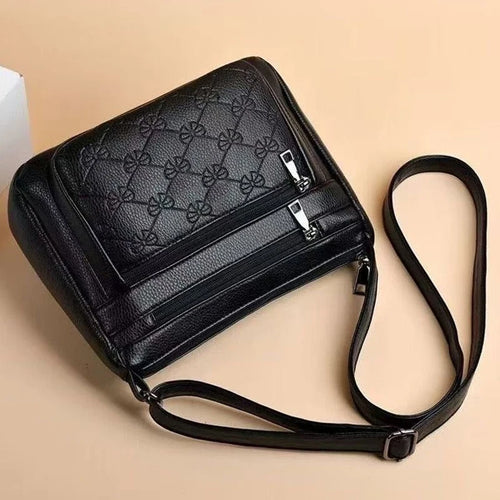 Bolsa transversal matelassê preta com vários compartimentos