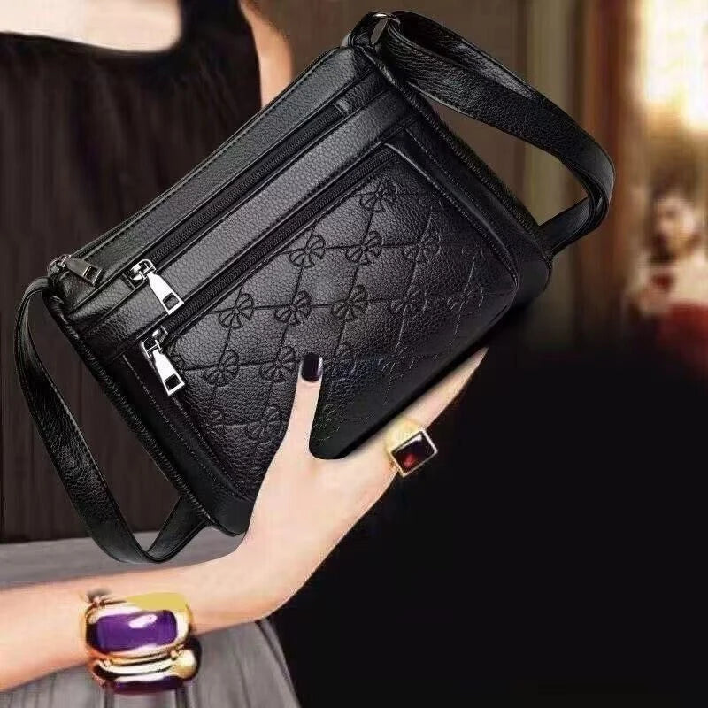 Bolsa transversal matelassê preta com vários compartimentos